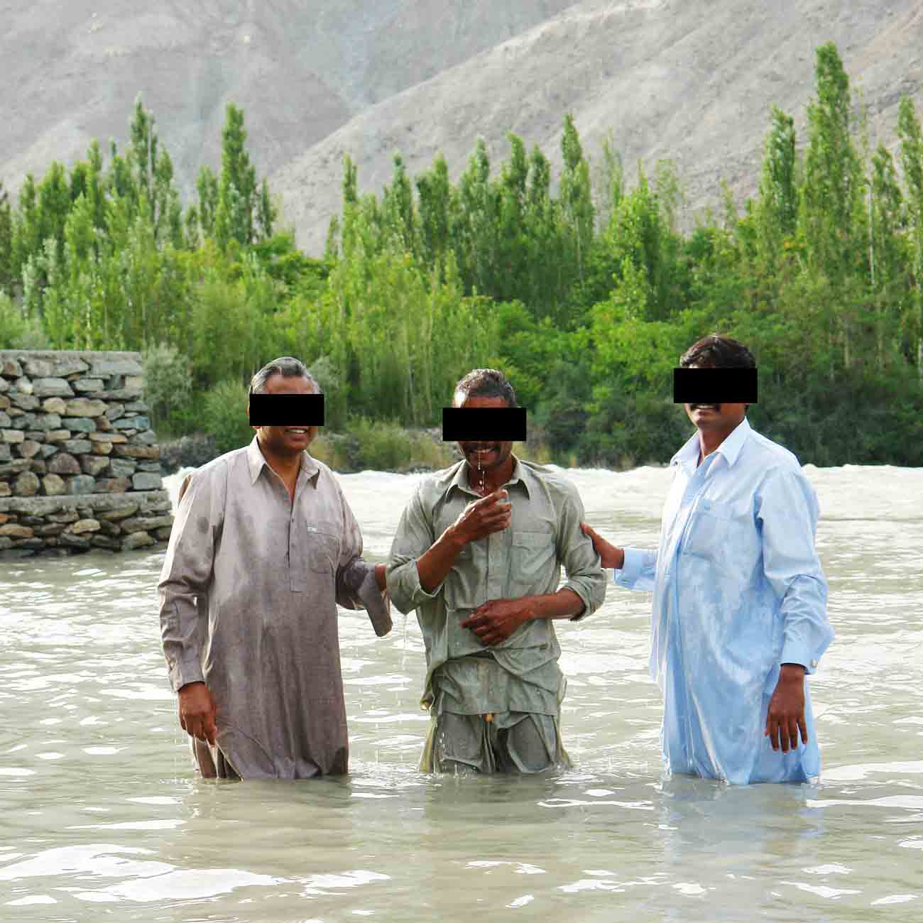 A young Pakistani man is baptized.