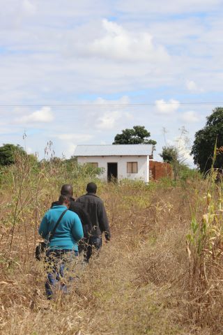 Yao church planters walking to a church building.