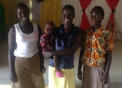 Desire (left) and her mother, Christine (middle), were kicked out of their home for trusting Christ.