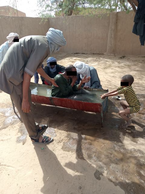 Idrissa being baptized.