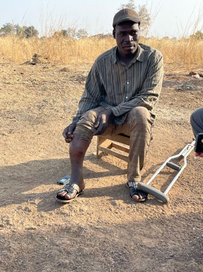 Pastor Michel with his crutch