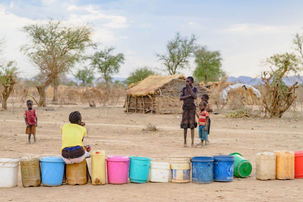 Christians in camps for displaced people often wait hours for water and worry about lack of food.