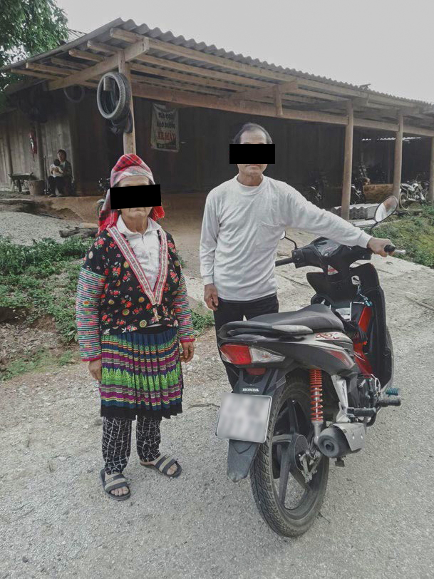 Thang, shown with his wife, travels thousands of miles a year on his motorbike to serve churches in his region.